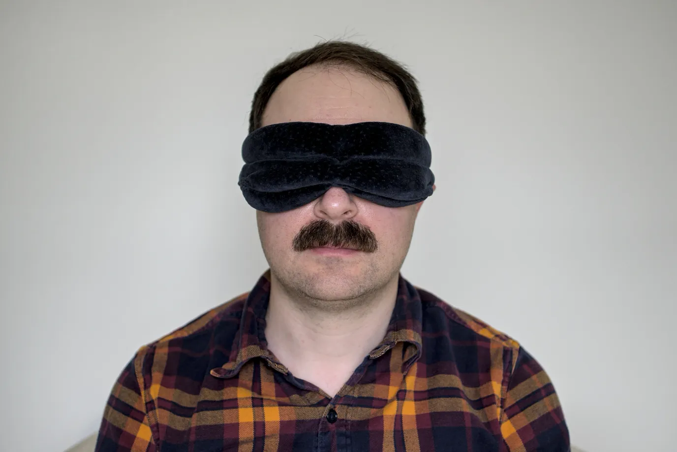 A photo of me wearing a Tempur-Pedic sleep mask